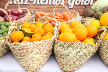 Orange baskets with other vegetables in the grocery