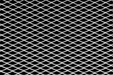 Rusty metal grid with geometric pattern of rhombi, black and white  background