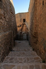 Historic city Mardin. Turkey - A view of the narrow streets of old Mardin, where stone houses are located.