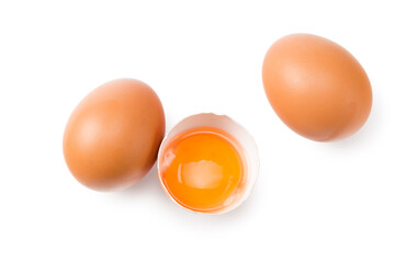 Chicken egg is half broken among other eggs isolated on white background. Top view