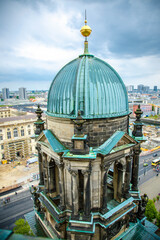The Berlin cathedral and Fernsehturn television tower stand side by side as respected icons of the...