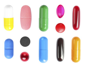Set with colorful pills on white background, top view