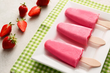 Plate with tasty strawberry ice cream on table