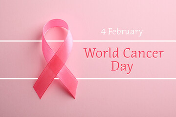 Pink ribbon on color background, top view. World Cancer Day