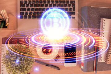 Double exposure of blockchain theme hologram over table with phone. Top view. Crypto technology...