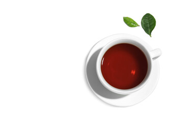 Cup of aromatic black tea and green leaves on white background, top view