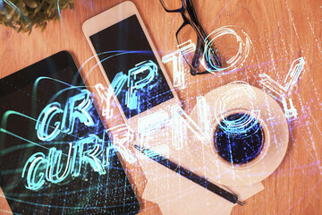 Double exposure of blockchain theme hologram over table with phone. Top view. Crypto technology...