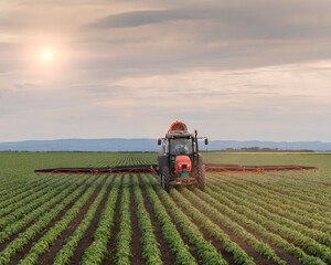 Spraying pesticides at soy bean fields