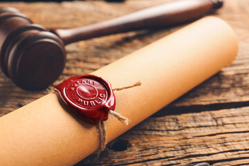 Scroll with notary public wax seal and gavel on table, closeup - obrazy, fototapety, plakaty