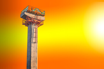 A bridge under construction in a yellow-orange background