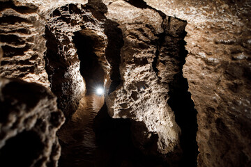 Dark Tunnel Cave has nobody. Tourist route, tours, adventures and interesting places. inside ancient crystal formations, stones, geology, explore of rocks of the soil. village Mlynky . Ukraine