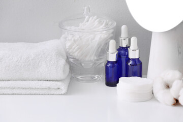 Obraz na płótnie Canvas Cosmetics and supplies on table in bathroom
