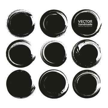 Set of black circle abstract textured smears isolated on a white background