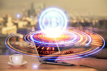 Double exposure of woman hands typing on computer and crypto market theme hologram drawing....