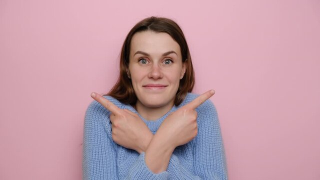 Questioned uncertain young woman crossed arms over chest, gives two variants and advertises product, wears blue sweater, asks advice as cant pick something, makes decision confusing. Concept options