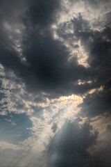 Picturesque clouds in the sky. Window view of an airplane on a sunny gloomy day. Stock photo background