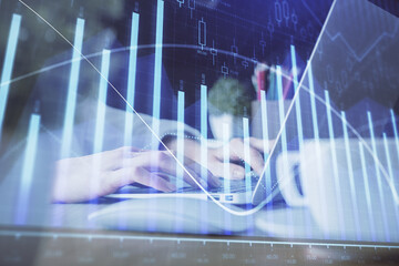 Double exposure of woman hands typing on computer and forex chart hologram drawing. Stock market invest concept.