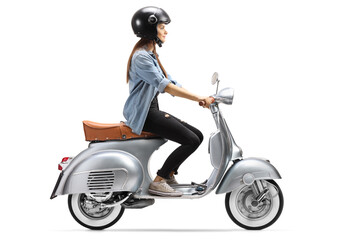 Full length profile shot of a young woman with a helmet riding a vintage scooter