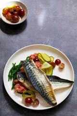 Grilled mackerel with gooseberry ketchup, pickled cucumber and whole gooseberries and samphire