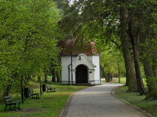 Obraz premium Chapel being part of the Way of the Cross, surrounded by the park. Wiele, Kaszuby, Poland. Early spring.