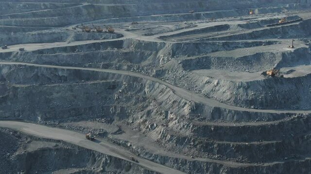 aerial view of asbestos quarry, silicate minerals mining. Drone flight industrial scene - open pit, quarry, mine, mining, transportation. environment and ecology concept