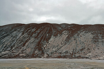 Amazing martian landscape, beautiful mountain landscape with salt mountains and sand ground. Salt plantations and salt lakes of the salt industry