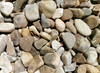 stones of different sizes of pebbles for texture, background, decoration in the style of natural scrapbooking, sea style