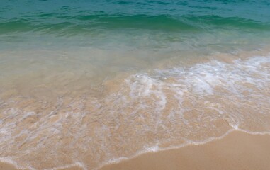 Wave of sea move to the sand beach.