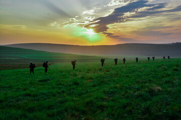 Silhouette of an army military man in combat at sunrise