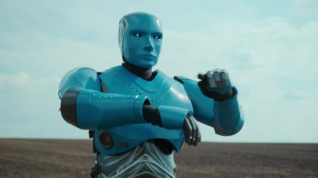 Futuristic cyber droid scanning the rural field using holographic touchscreen virtual reality analyzing farmland cultivation. Smart agriculture. For animation. Future technology.