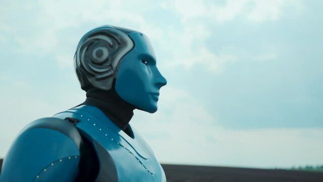 Blue futuristic robo worker cybernetic humanoid droid robotic cyborg standing on field scanning farmland agriculture. Future technology. Artificial intelligence.