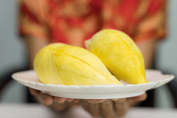  Asian women holding durian ripe