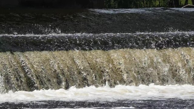 water cascading down a small waterfall