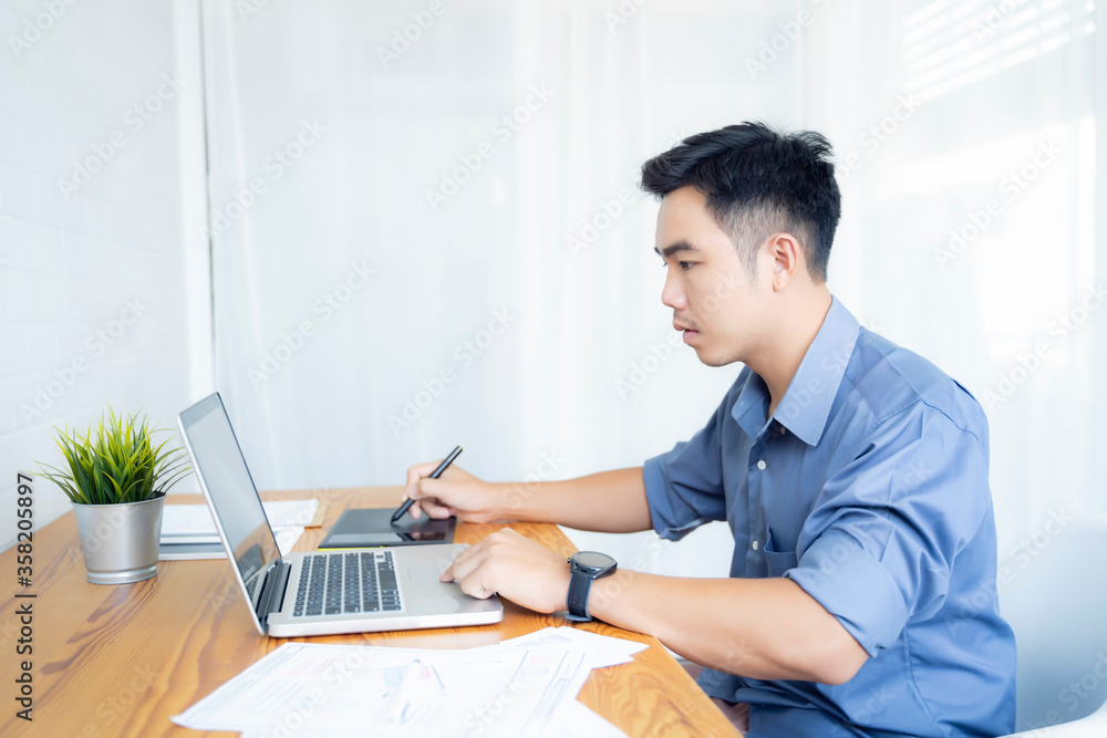 Fototapete Working from home web designing graphical user interface UX UI, home office using computer laptop and pen sketching graphics tablet device creative planning innovative ideas, asian man quarantine