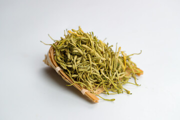Fototapeta na wymiar Dried honeysuckle flower tea on white background 