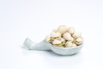 Fototapeta na wymiar Pistachio Nuts isolated on a white background.