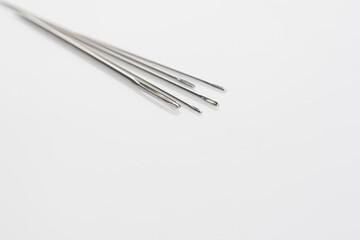 Bunch of needles isolated over white,macro shot,eye angle level.
