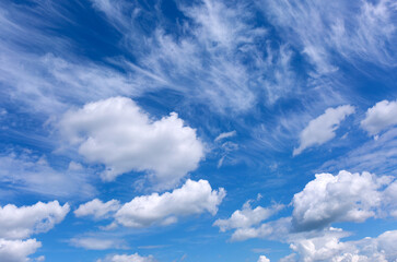 Blue sky background with white clouds.
