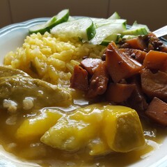 Caribbean curried mango, stewed potatoes and peas,  saffron rice with cucumbers 