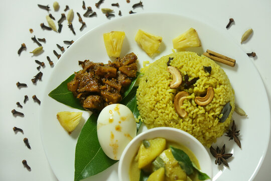 Ghee Rice with pineapple curry and potato curry