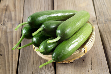 fresh cucumbers on wooden table
