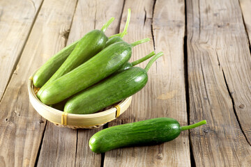 fresh cucumbers on wooden table