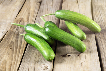 fresh cucumbers on wooden table