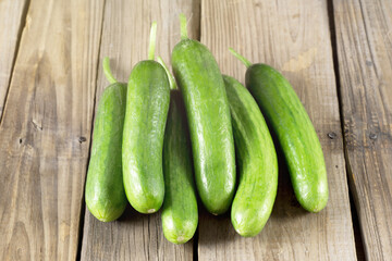 fresh cucumbers on wooden table