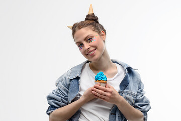girl with blue cupcake isolated on white