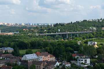 Fototapeta na wymiar view of the Czech countryside near Prague and buildings in the background and tracks and a viaduct for trains