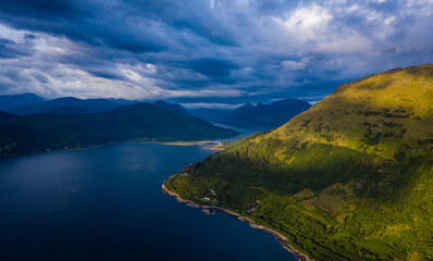 aerial image of the entrance to glencoe, ballachulish and loch leven from loch linnhe on the west coast of the argyll and lochaber region of the highlands of scotland on a clear blue sky summer day