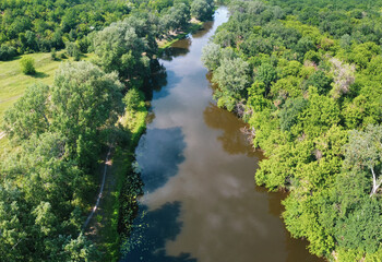 River in forest. Aerial summer scenery.