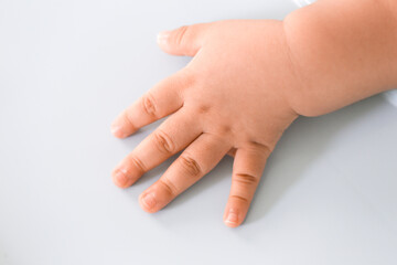 close up of chubby baby arm - Focus piont cencept.