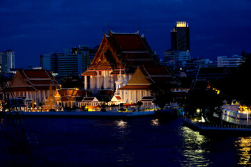Thai temple by the river in the night